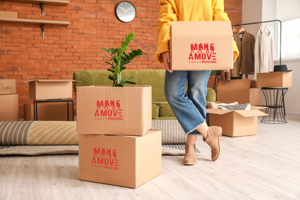 lady in yellow carrying a box