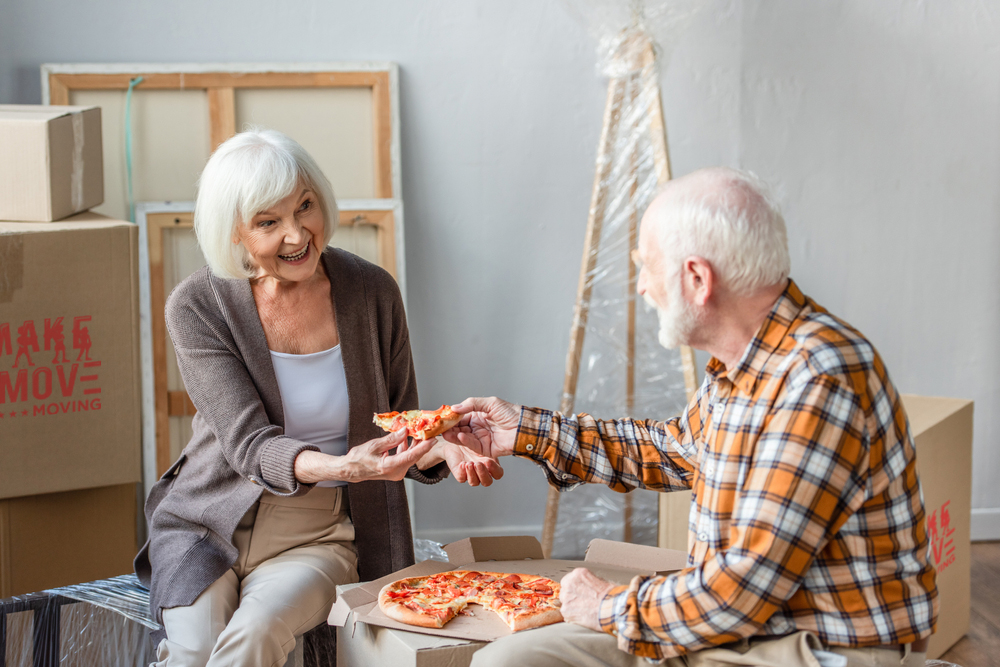 old couple sharing a pizza