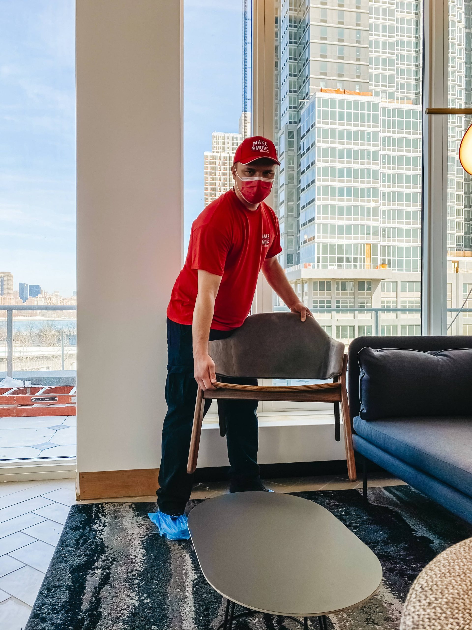 guy carrying a chair