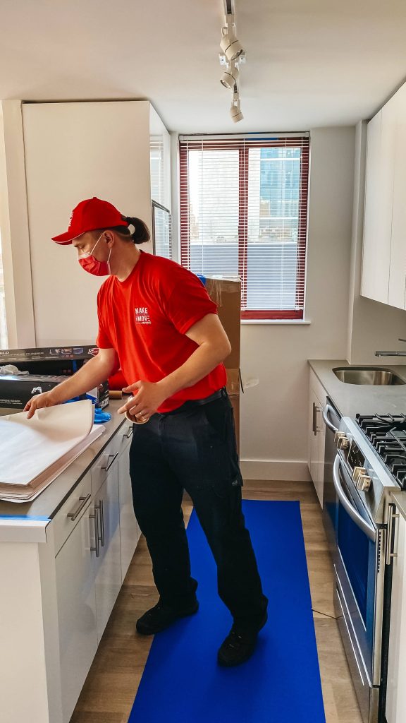 a moving guy inside the kitchen