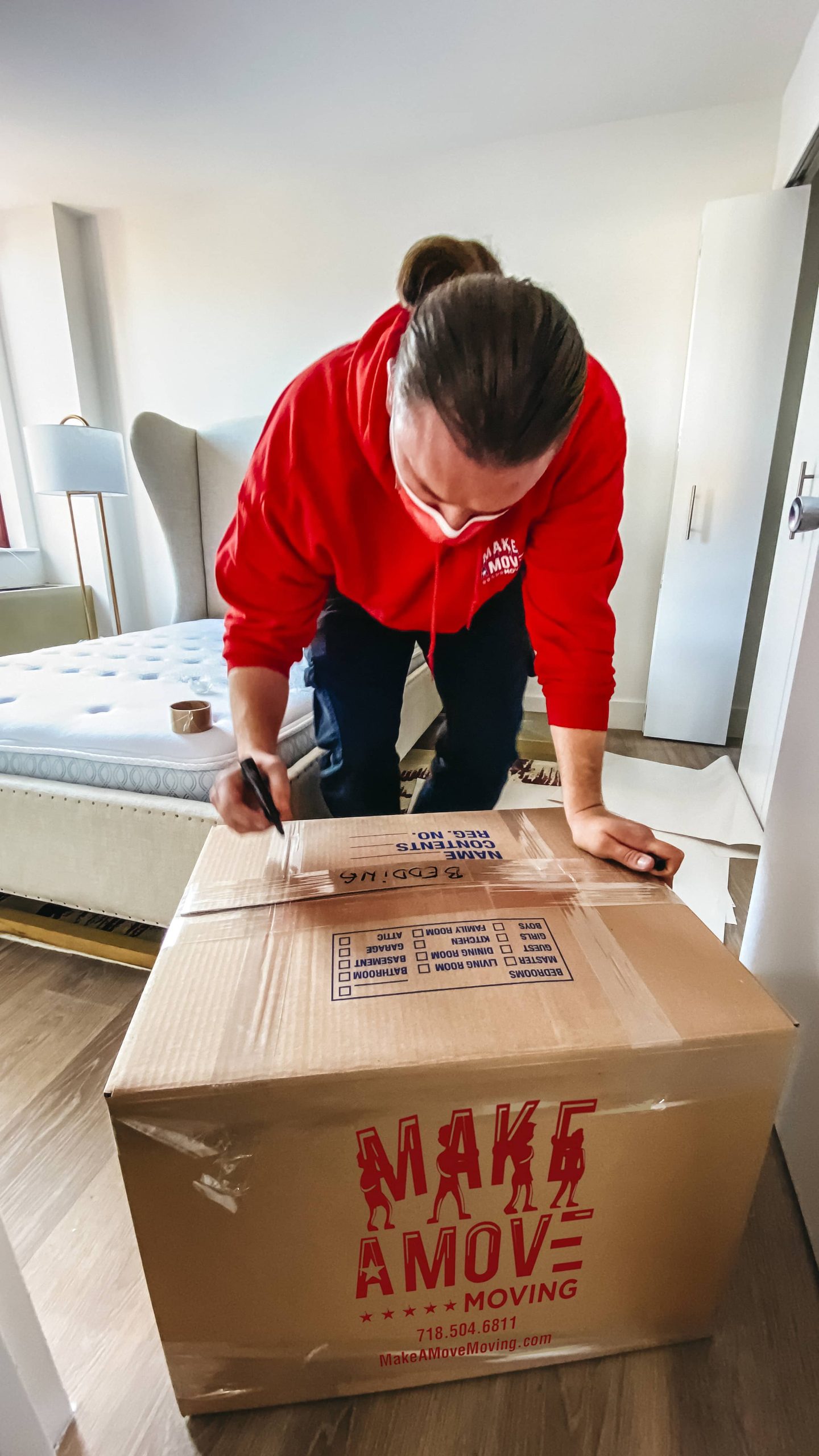 guy labeling a box